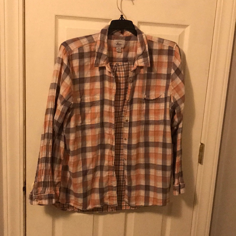 A women’s collared long sleeve plaid shirt